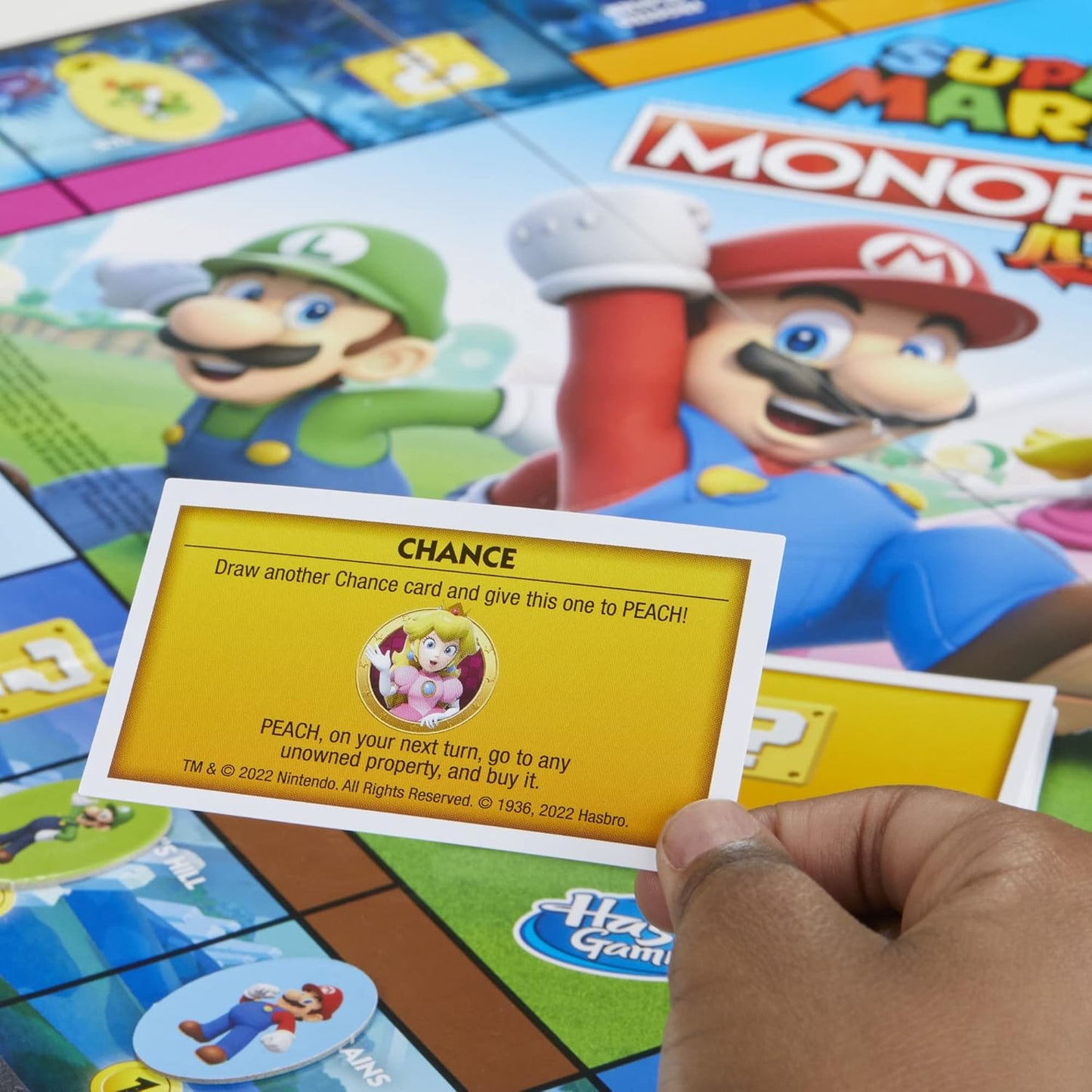 HotMonopoly Junior Super Mario Edition Board Game, Fun Kids' Ages 5 and Up, Explore The Mushroom Kingdom as Mario, Peach, Yoshi, or Luigi (Amazon Exclusive)